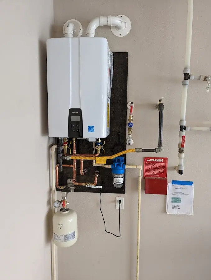 Professional plumber installing copper piping in a Hainesport home